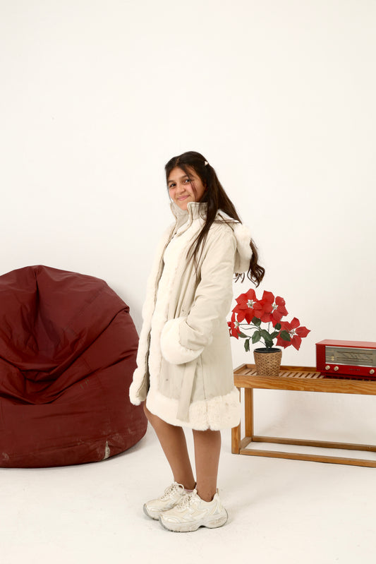 winter coat featuring plush faux-fur trim along the front, cuffs, and hood