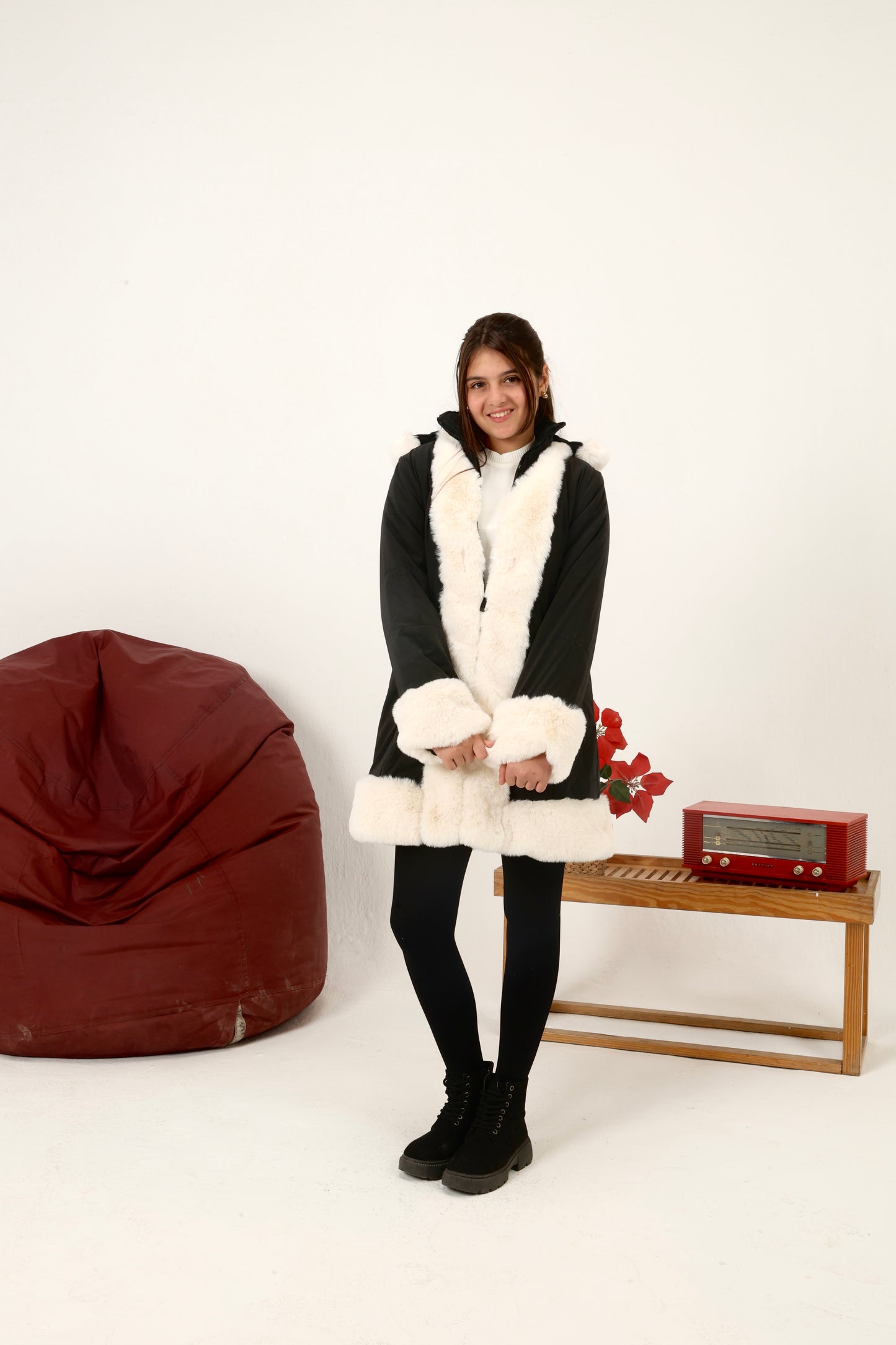winter coat featuring plush faux-fur trim along the front, cuffs, and hood
