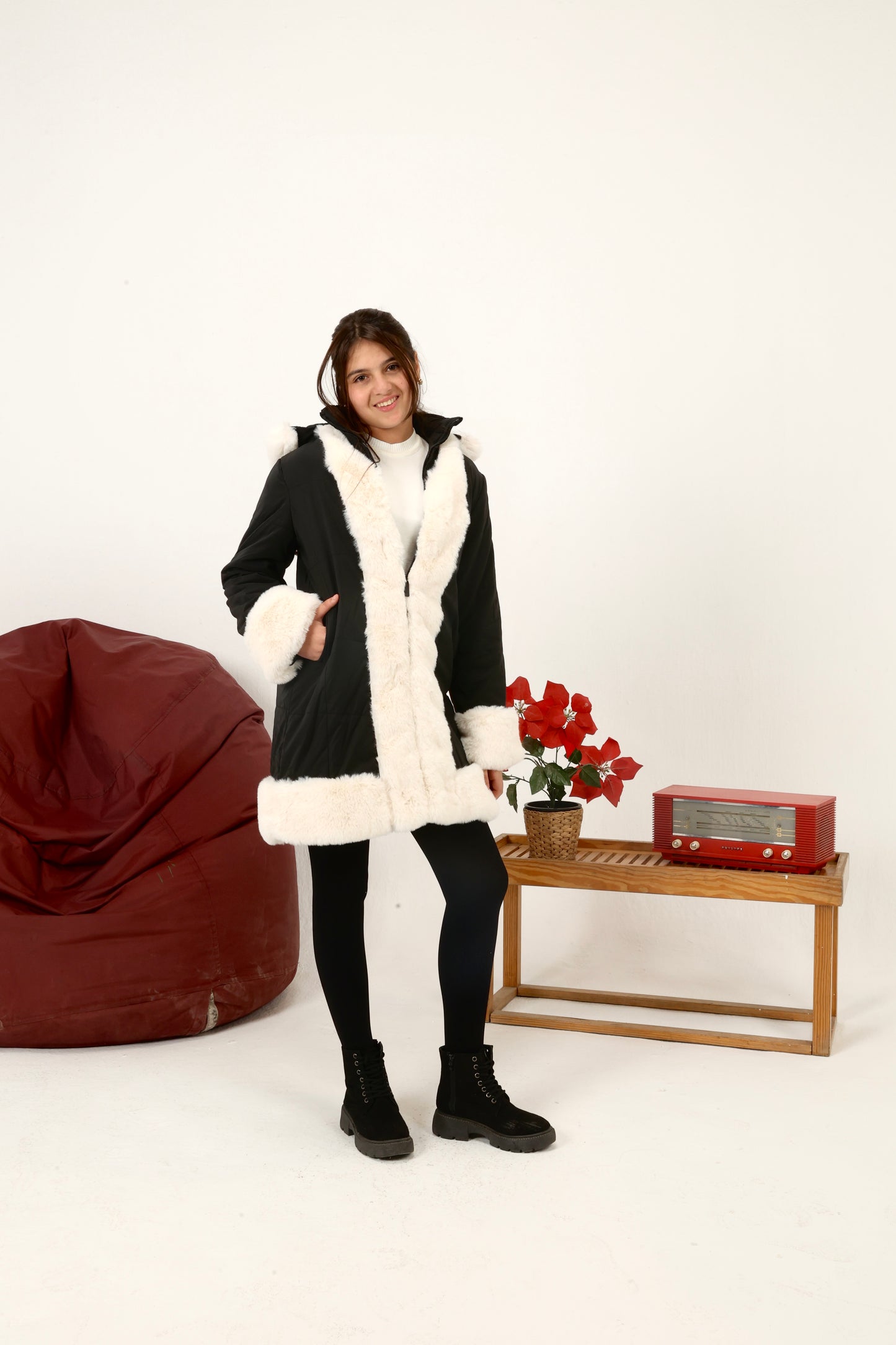 winter coat featuring plush faux-fur trim along the front, cuffs, and hood