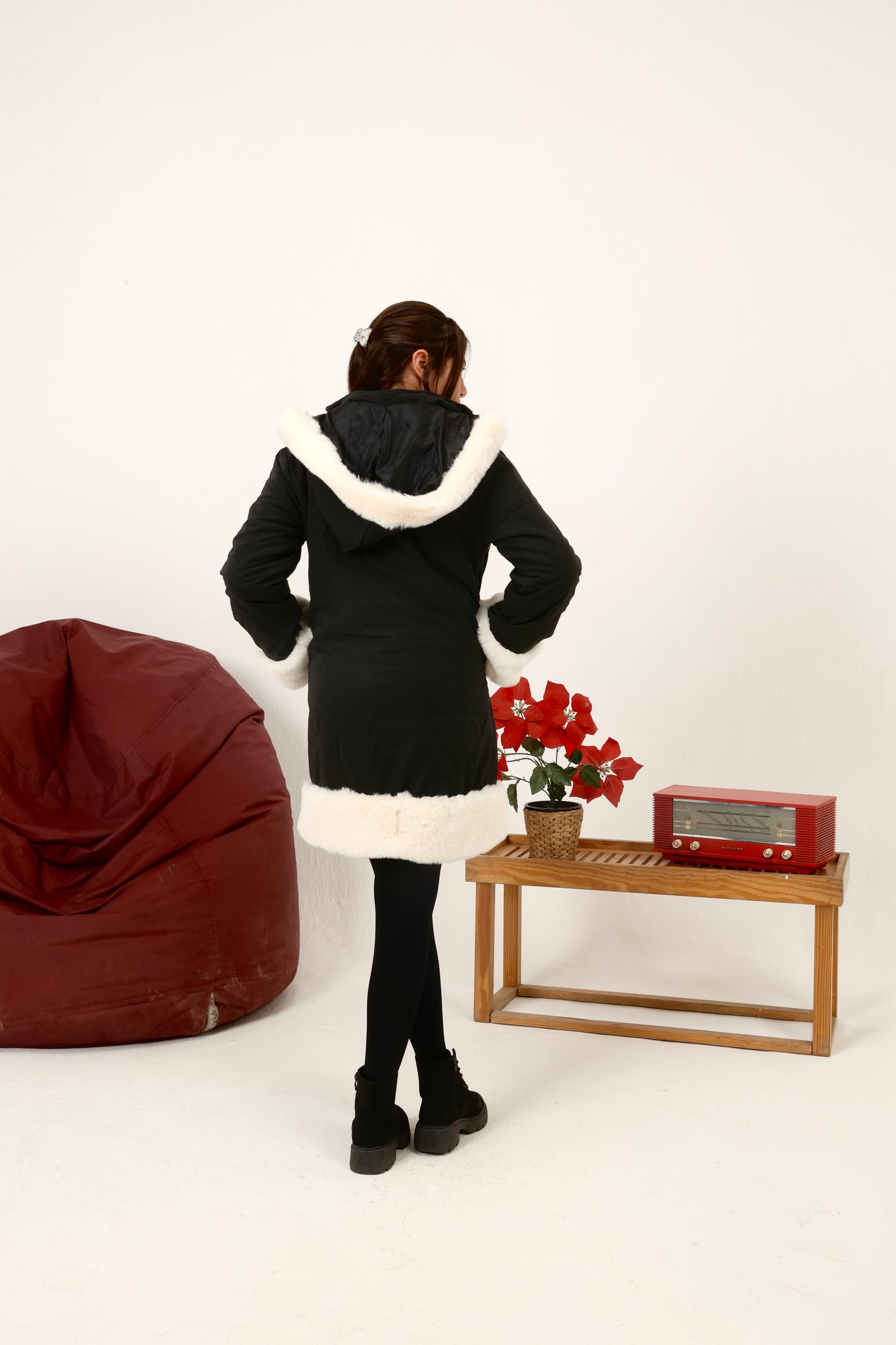 winter coat featuring plush faux-fur trim along the front, cuffs, and hood
