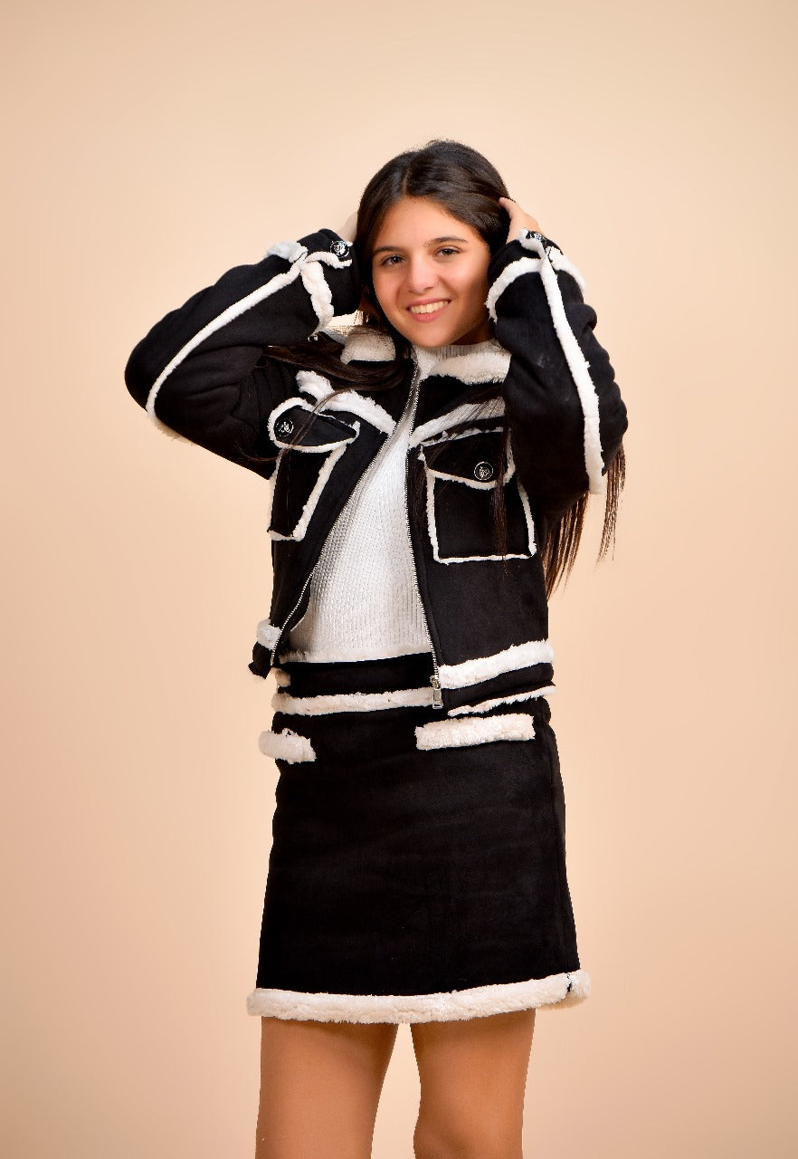 jacket paired with a matching mini skirt