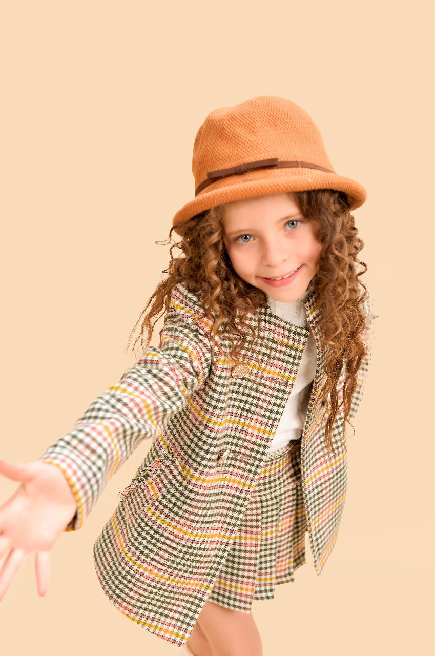 tweed two-piece set a tailored jacket and pleated skirt.