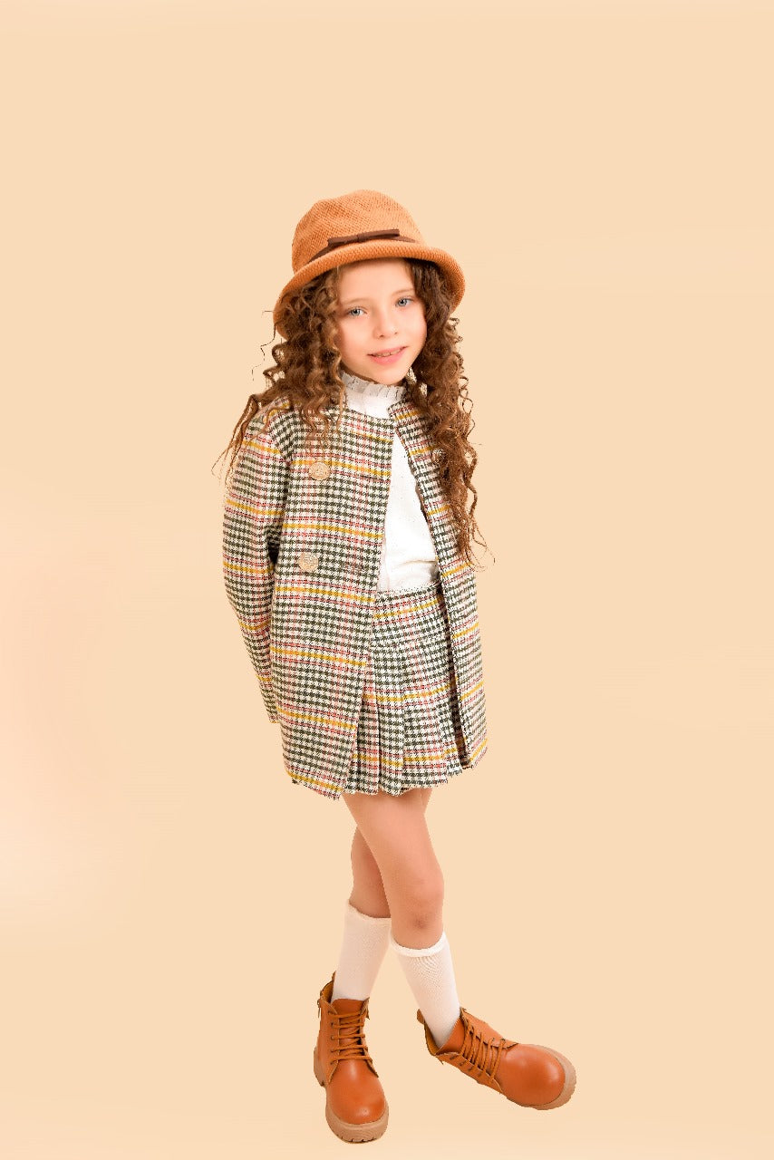 tweed two-piece set a tailored jacket and pleated skirt.