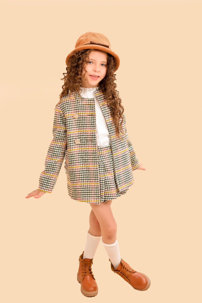 tweed two-piece set a tailored jacket and pleated skirt.