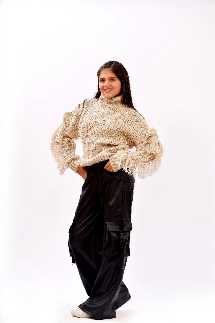 fringe detailing along the sleeves and sides sweater